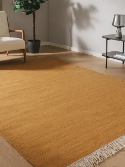 Alfombra artesanal de lana con flecos Liv