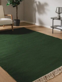 Alfombra artesanal de lana con flecos Liv