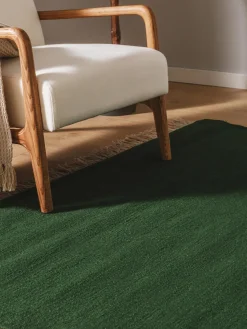 Alfombra artesanal de lana con flecos Liv