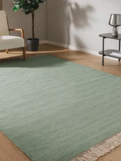 Alfombra artesanal de lana con flecos Liv