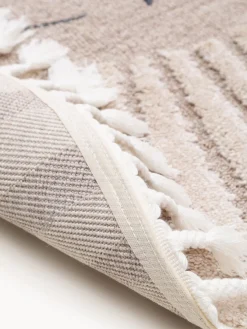 Alfombra infantil redonda texturizada con borlas Momo