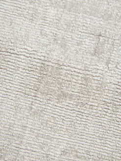 Alfombra redonda artesanal de viscosa Jane