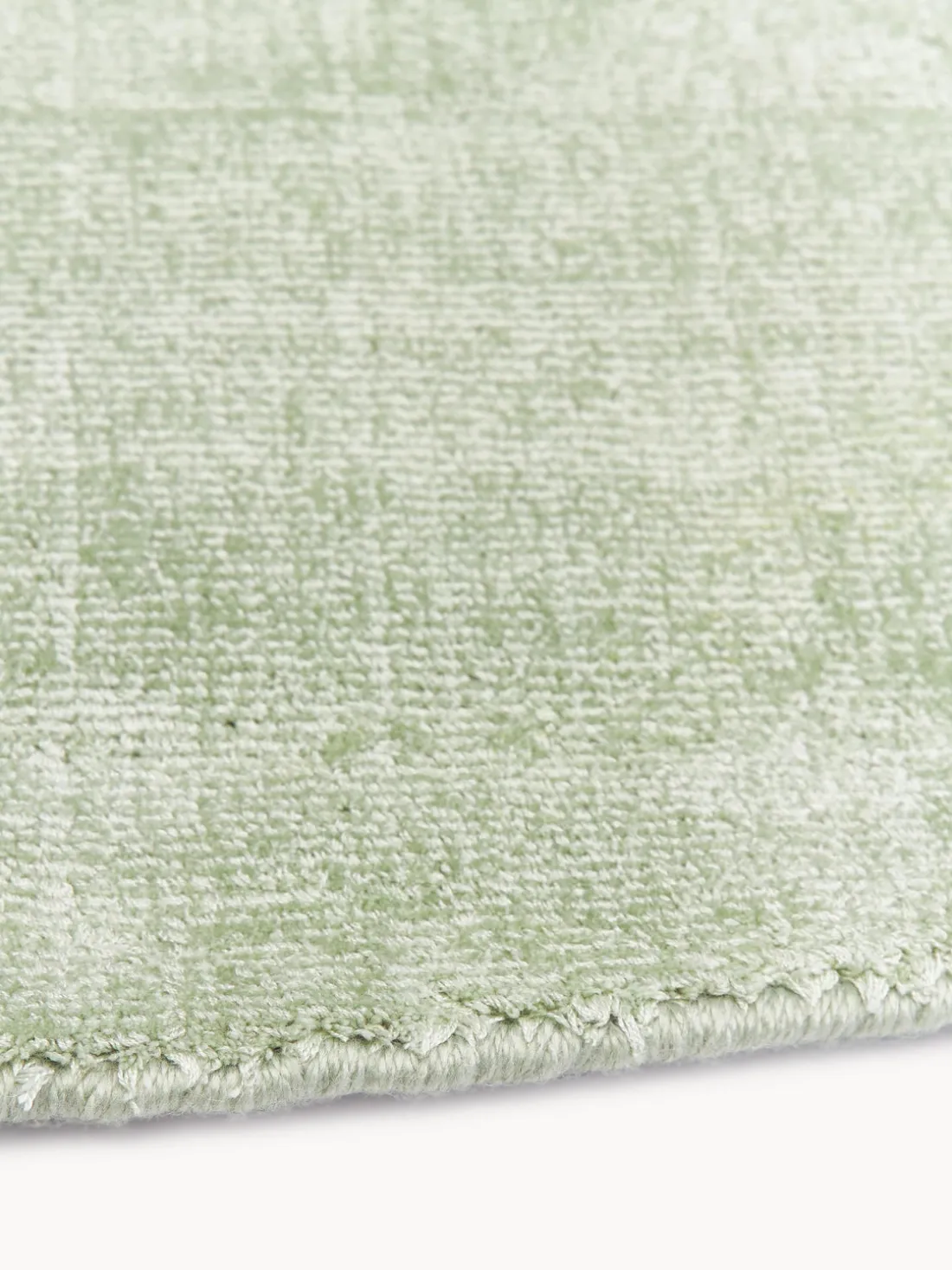 Alfombra redonda artesanal de viscosa Jane