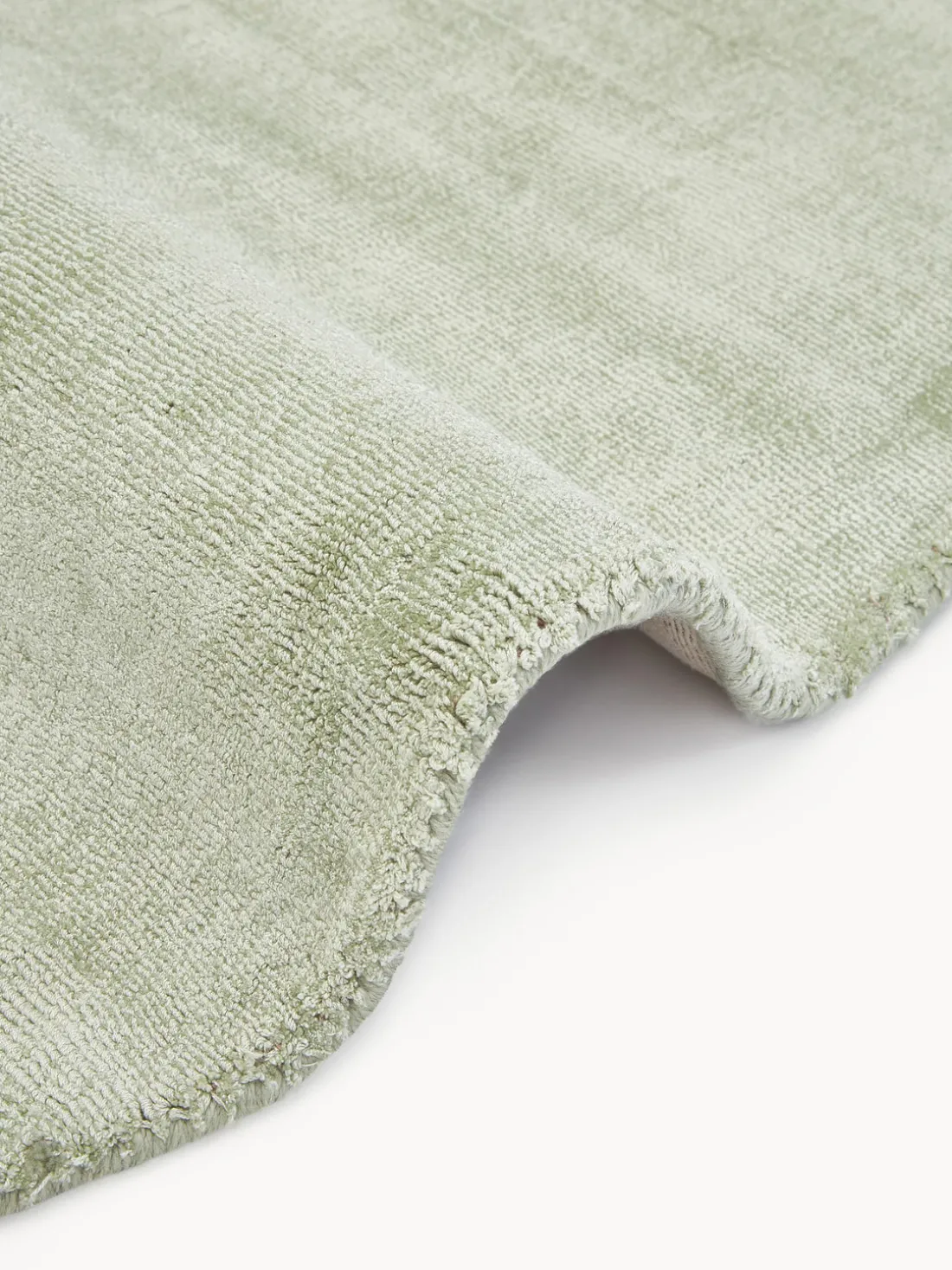 Alfombra redonda artesanal de viscosa Jane