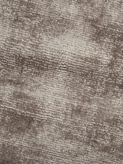 Alfombra redonda artesanal de viscosa Jane