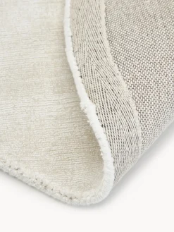 Alfombra redonda artesanal de viscosa Jane