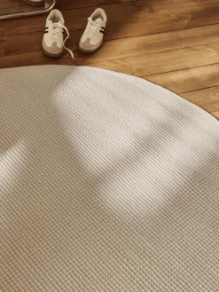 Alfombra redonda artesanal de lana Amaro