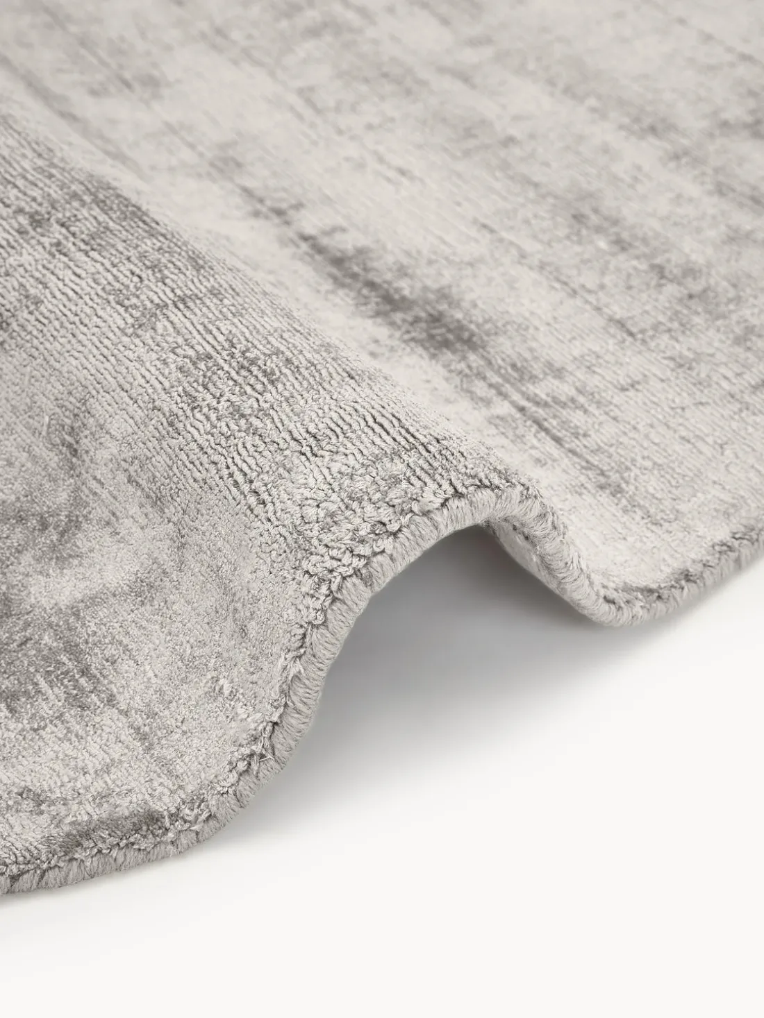 Alfombra redonda artesanal de viscosa Jane