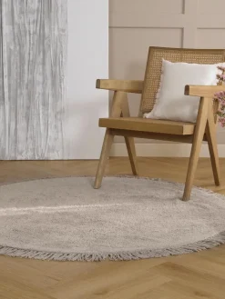 Alfombra redonda artesanal de algodón con flecos Daya