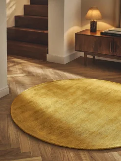 Alfombra redonda artesanal de viscosa Jane