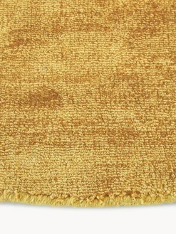 Alfombra redonda artesanal de viscosa Jane