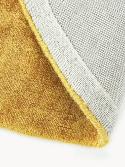 Alfombra redonda artesanal de viscosa Jane