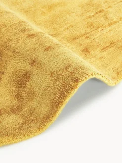 Alfombra redonda artesanal de viscosa Jane