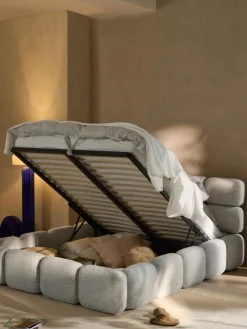 Cama tapizada en tejido bouclé con espacio de almacenamiento Tayla