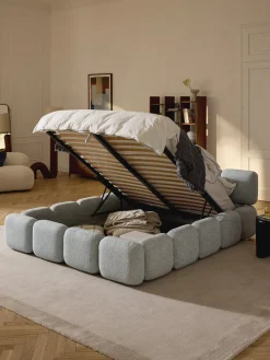 Cama tapizada en tejido bouclé con espacio de almacenamiento Tayla