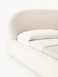 Cama tapizada redondeada en tejido bouclé Alba