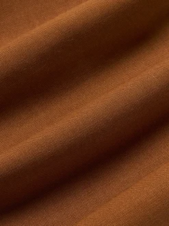 Cojín artesanal con mechones decorativos Cleo