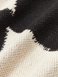 Cojín grande artesanal con motivos geométricos Asta