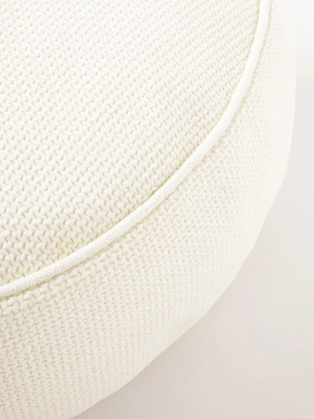 Cojín redondo en tejido bouclé con ribete Aya