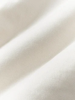 Funda de cojín artesanal con relieves Malu