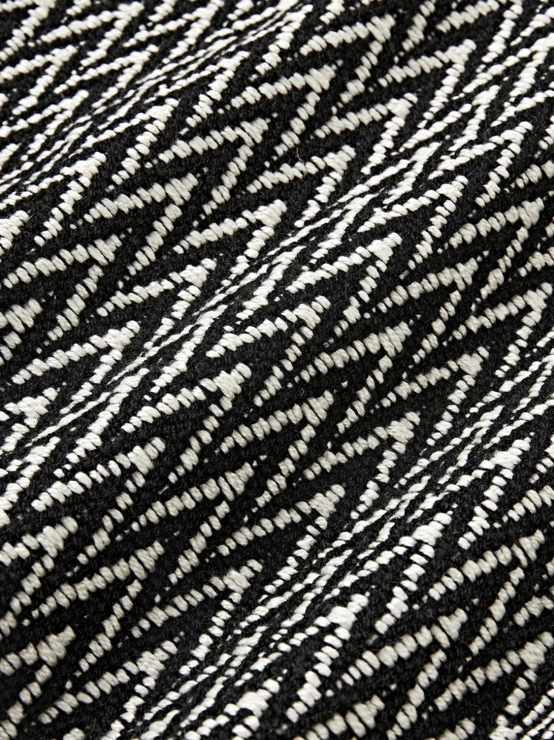 Funda de cojín para exterior con tejido artesanal y flecos Suria