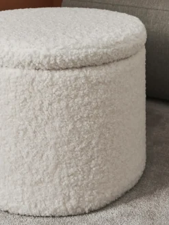 Puf de borreguillo con espacio de almacenamiento Alida