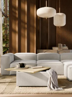 Reposapiés puf en tejido bouclé con espacio de almacenamiento Lennon