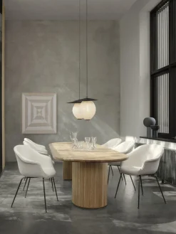 Silla con reposabrazos en tejido bouclé Bat