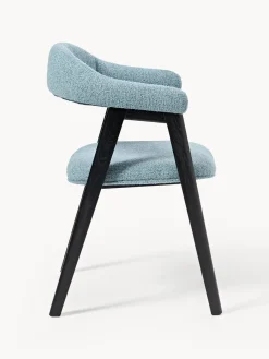 Silla con reposabrazos tapizada en tejido bouclé Nik