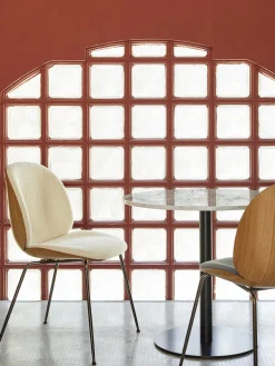 Silla tapizada en tejido bouclé con asiento Beetle