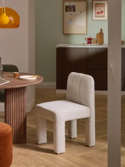 Silla tapizada en tejido bouclé Lukas