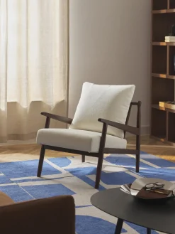 Sillón en tejido bouclé Mikkel