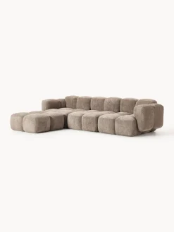 Sofá modular de borreguillo bouclé con reposapiés Tayla (4 plazas)