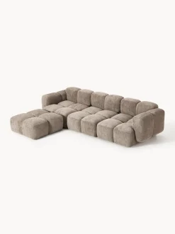Sofá modular de borreguillo bouclé con reposapiés Tayla (4 plazas)