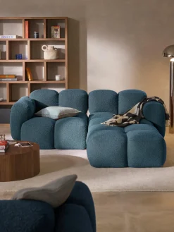 Sofá modular en tejido bouclé con reposapiés Tayla (3 plazas)