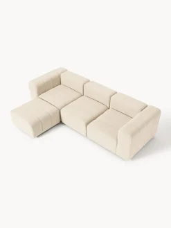 Sofá modular en tejido bouclé con reposapiés izquierdo/derecho Lena (4 plazas)