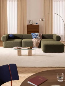 Sofá modular en tejido bouclé Anton (4 plazas), con reposapiés (izquierda/derecha)