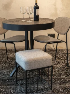 Taburete tapizado en tejido bouclé Milou